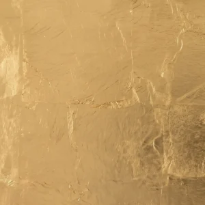 Hand-applied gold leaf finish on custom wrought iron, showcasing luxury Italian metalwork textures for high-end interior design projects.