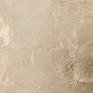 Elegant white gold leaf finish on artisanal metalwork, delivering a refined, luminous texture for exclusive international interior architecture.